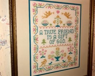 Counted cross-stitch sampler in pastel colors  