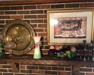 Crewel embroidery completed by Mrs. Nell Ross.  Items displayed on mantle brass candle sticks & plate, pottery vase, pink Indiana glass candy dish and a depression era lamp. 