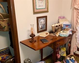 Singer sewing machine and accessories, an abundance of sewing and quilting supplies. 