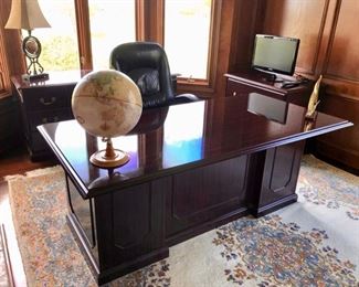 Here is the desk with a credenza behind, file cabinet with a monitor sitting above, and a Lane office chair.  I love the carpet in here too,