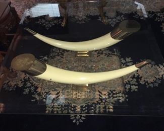 Faux tusk on lucite base, beveled glass top