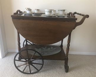 Antique tea cart with glass top tray