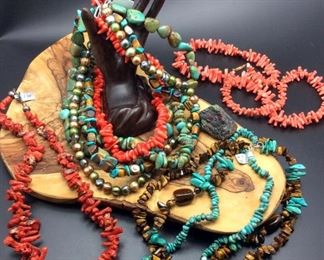 Semi-precious stone necklaces including coral, turquoise, tiger's eye and freshwater pearls, 50% off
