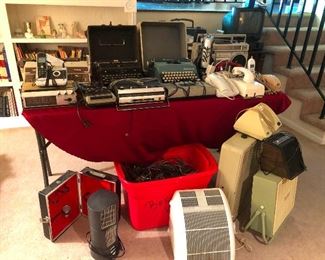 old typewriters! Electronics, heaters, fans, that's a travel bar with a shot glass on the left there.