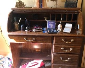 roll top desk with big-handed brass knobs, ammiright? Ooh, vintage train case!