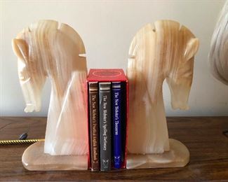 marble bookends carved in the shape of things found at the foot of the beds of Mafia extortion victims