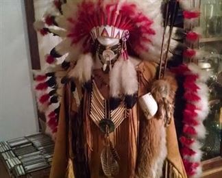 Native American headdress and leather outfit