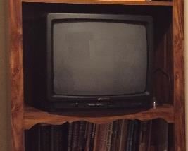 Entertainment Center Three Sections, T.V., VHS Tapes, VCT, DVD Players, Assorted Lanterns, Collectible Choppers/Planes Encased