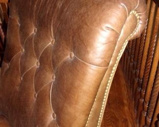 Leather tufted nail-head trim library chair with ottoman on castors