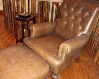 Leather tufted nail-head trim library chair with ottoman on castors