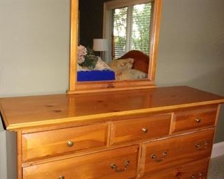 Queen pine headboard, 2 end tables, dresser and mirror and chest of drawers in excellent condition.