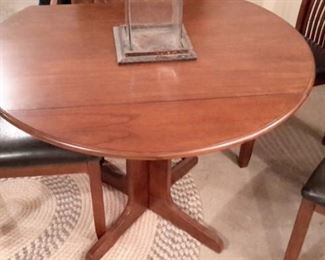 Cute drop leaf table with four chairs, in great shape!