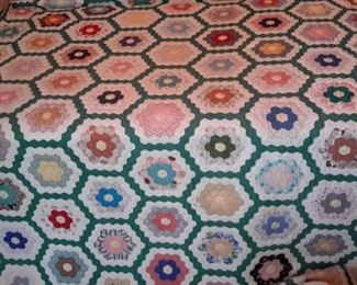 Beautiful hand-made full-size quilt, currently attached to board for hanging, but can be removed.