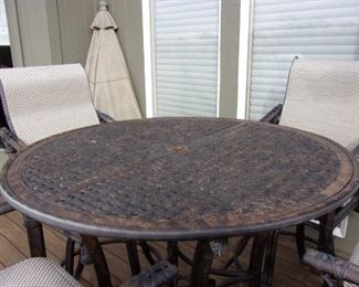 Quality Luxury brand Castelle Patio Table and Four swivel bar chairs $1,000. OUR PRICE OBO/New it is over $5,000 Table alone new is $1,100.00 see link https://www.patioliving.com/castelle-sienna-tables-cast-aluminum-round-patio-bar-table-pfdch42 Similar Chairs over $1,200 each see link https://www.patioliving.com/castelle-resort-fusion-sling-dining-patio-bar-stool-pf9d99