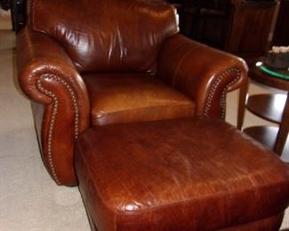 Leather rolled armed/nailhead trimmed Sofa/couch with matching chair and ottoman! Excellent condition! PLEASE NOTE PRINT FABRIC CUSHIONS ON SOFA ARE CUSTOM AND THIS SOFA COMES WITH ORIGINAL LEATHER COVER FOR CUSHIONS ON SOFA:)