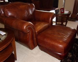 Leather rolled armed/nailhead trimmed Sofa/couch with matching chair and ottoman! Excellent condition! PLEASE NOTE PRINT FABRIC CUSHIONS ON SOFA ARE CUSTOM AND THIS SOFA COMES WITH ORIGINAL LEATHER COVER FOR CUSHIONS ON SOFA:)