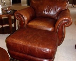 Leather rolled armed/nailhead trimmed Sofa/couch with matching chair and ottoman! Excellent condition! PLEASE NOTE PRINT FABRIC CUSHIONS ON SOFA ARE CUSTOM AND THIS SOFA COMES WITH ORIGINAL LEATHER COVER FOR CUSHIONS ON SOFA:)