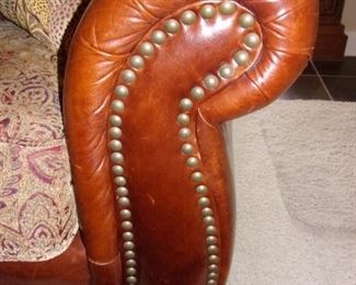 Leather rolled armed/nailhead trimmed Sofa/couch with matching chair and ottoman! Excellent condition! PLEASE NOTE PRINT FABRIC CUSHIONS ON SOFA ARE CUSTOM AND THIS SOFA COMES WITH ORIGINAL LEATHER COVER FOR CUSHIONS ON SOFA:)