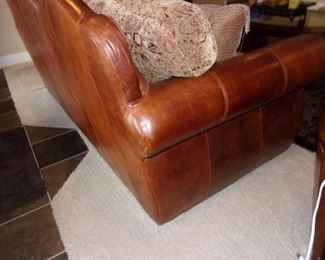 Leather rolled armed/nailhead trimmed Sofa/couch with matching chair and ottoman! Excellent condition! PLEASE NOTE PRINT FABRIC CUSHIONS ON SOFA ARE CUSTOM AND THIS SOFA COMES WITH ORIGINAL LEATHER COVER FOR CUSHIONS ON SOFA:)