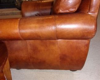 Leather rolled armed/nailhead trimmed Sofa/couch with matching chair and ottoman! Excellent condition! PLEASE NOTE PRINT FABRIC CUSHIONS ON SOFA ARE CUSTOM AND THIS SOFA COMES WITH ORIGINAL LEATHER COVER FOR CUSHIONS ON SOFA:)