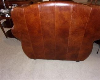 Leather rolled armed/nailhead trimmed Sofa/couch with matching chair and ottoman! Excellent condition! PLEASE NOTE PRINT FABRIC CUSHIONS ON SOFA ARE CUSTOM AND THIS SOFA COMES WITH ORIGINAL LEATHER COVER FOR CUSHIONS ON SOFA:)