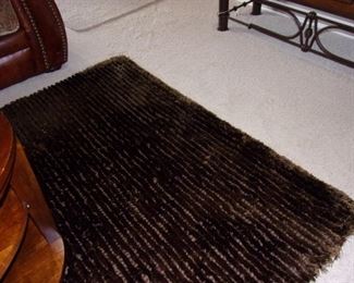 Large thick dark chocolate area rug