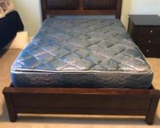Queen head, foot board and side rails with woven leather accent. Simmons Queen double pillow top mattress and box springs.