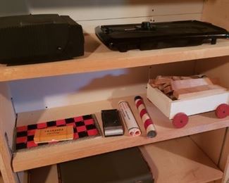 Checker board, toys, vintage suitcase, projector, electric skillet