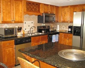 Granite counter tops - fully furnished kitchen with stainless appliances