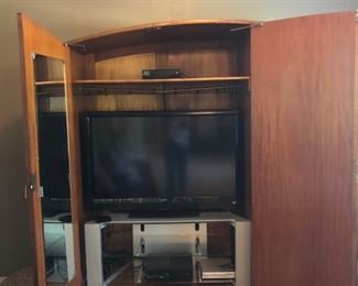 Main Body of the Armoire. Shown here with TV and Stand (Not included, will negotiate if interested). Mirror on Left inside door. Shelf is removable.