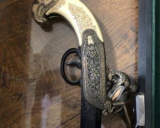 19th century elaborately carved derringer stock that has been converted  to a walking stick.