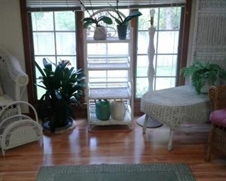 Stunning wicker furniture-plants and check out that room divider!