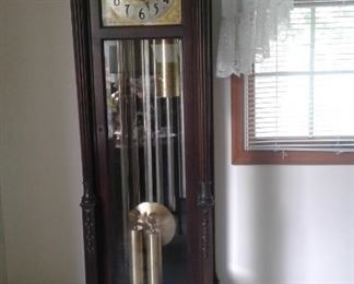 Grandfather clock with lots of pedigree-details to follow: Colonial-manufacturer. 6 tubes. 2 sets of chimes-one for the hours one for the 1/4 hours. Westminster and Canterbury. Phases of the moon. Stunning carving on the front