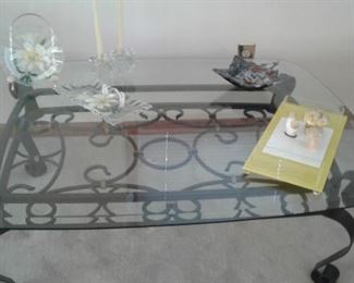 Beautiful heavy beveled glass coffee table ornate metal base with some funky mid century-70s accessories. The yellow lucite cheese and cracker are my favorite-altho the stone mushrooms are fun.