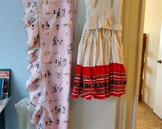Left is vintage probable 1950s Minnie and Mickey Mouse toddler bed cotton coverlet. To the right is vintage 1940s or 1950s Mexico blouse and FULL skirt