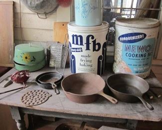 country table, tins & cast iron pans