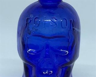 Skull shaped cobalt blue poison bottle. This is one of the most sought after antique poison bottles by collectors. There are two in this sale. 