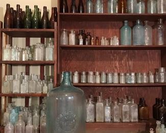 Wide ranging antique bottle collection, utility bottles, medicine bottles, Natchez embossed pharmacy bottles, poison bottles, spirits bottles, Free blown bottles, mold blown bottles, embossed bottles. 