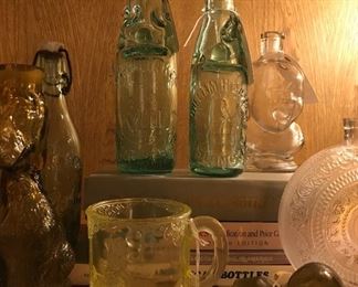 Antique bottles with personality plus!  Bring home the crying baby - please!