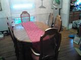 Dining Room Table w/ 2 captains chairs, 4 side chairs and table leaf - Measures approximately 62 x 41