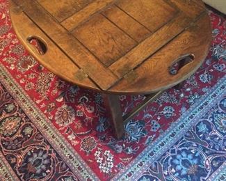 Butlers tray table. The tray is removable. Oriental carpet not for sale.