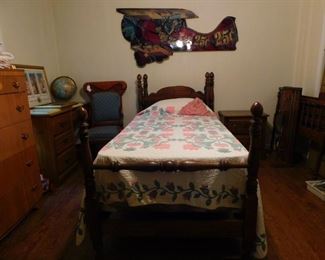 The Kid's Bedroom offers a pair of twin poster beds, quilts, and lots of antique/collectible toys