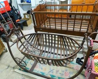 Antique baby cribs, the swinging crib w/wheels was used for mothers working out in the cotton fields to pull along so their babies could be with them.