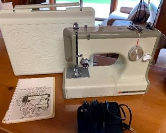 Model 1040 Kenmore sewing machine with floral case 
