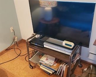 TV, stand, books