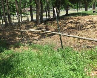 FENCING. PULL UP THE POSTS AND ROLL UP THE WIRE.