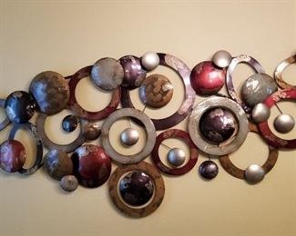 Metal wall art, 70 inches wide