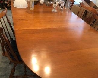 Maple oval dining table with 2 leaves inserted