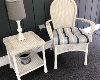 White wicker chair and end table