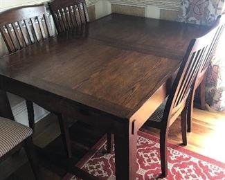 Dining room table (Ashley's) w/embedded leaf and six chairs